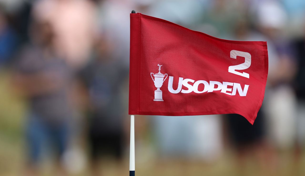 A US Open flag flutters in the wind