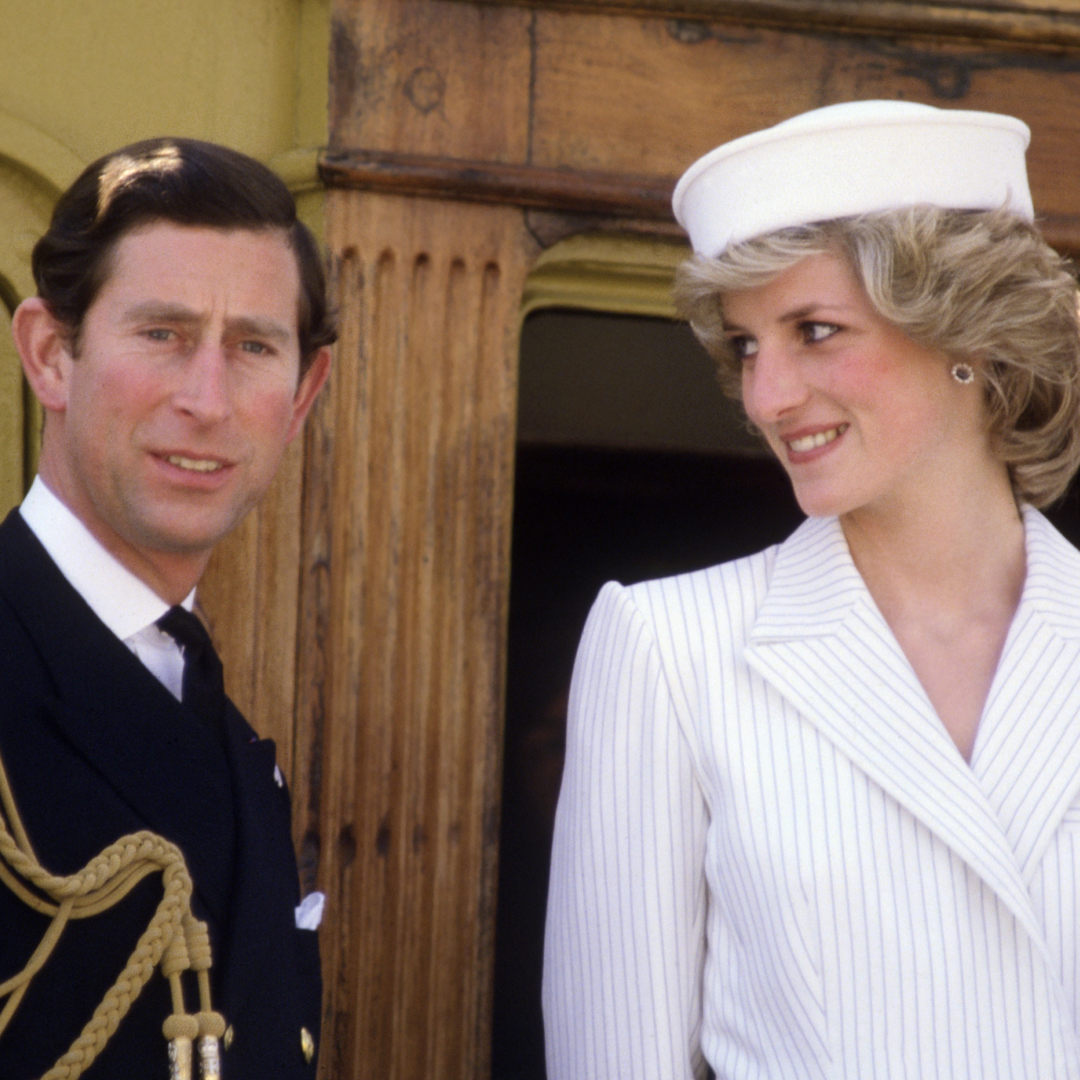King Charles wears naval uniform and Princess Diana wears a white pinstripe outfit with a matching hat on a boat in La Spezia, Italy, April 20, 1985.