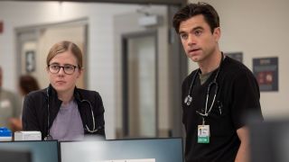 From left to right: Mel and Langdon standing next to each other on The Pitt.