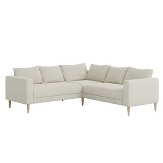 An oat colored L-shaped corner sectional for sustainable furniture brands.