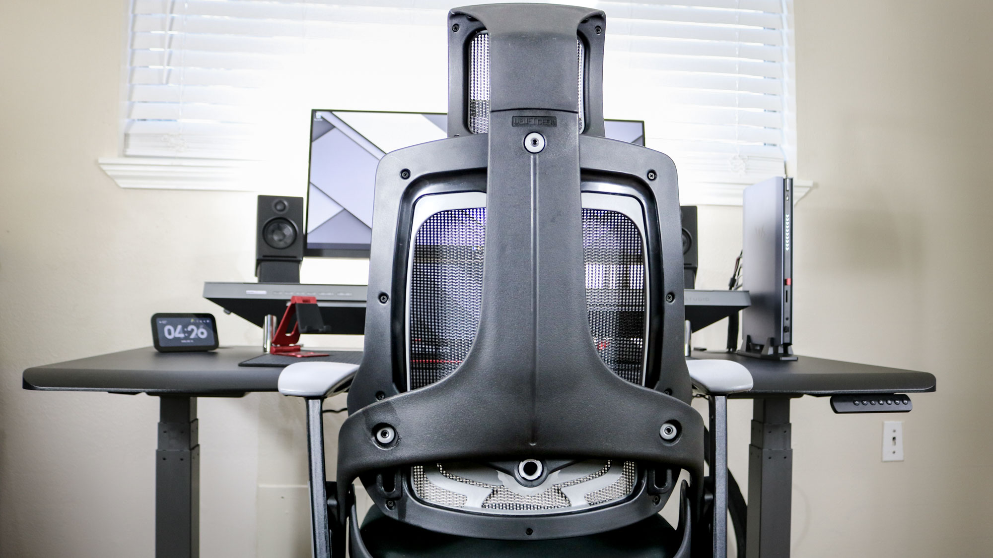 The Uplift Pursuit office chair pushed into a desk