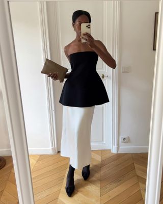 Sylvie Mus in skirt and hourglass top.