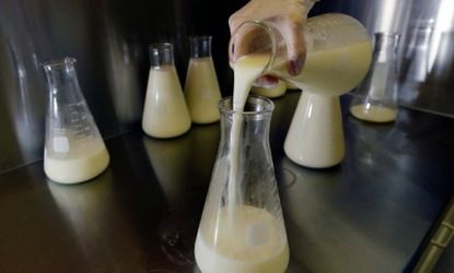 A lab technician at the Mothers' Milk Bank of New England in Newtonville, Mass., pours donated breast milk as it's prepped for pasteurization: Last year, the nation's largest milk bank group 