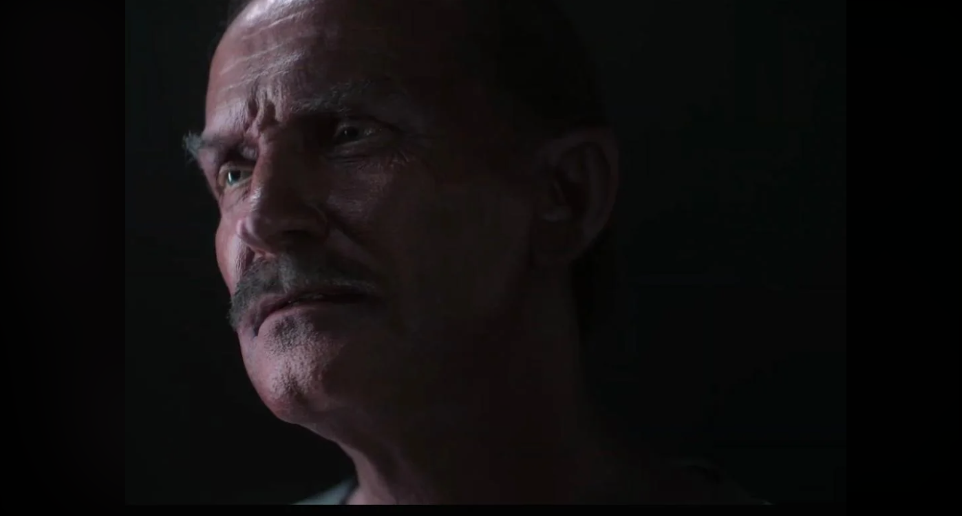 a red-skinned man with a mustache