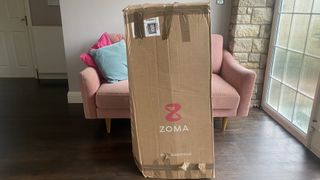 Zoma Mattress boxed up in our tester's living room