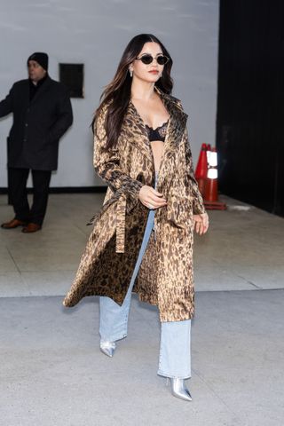 Jenna Dewan wears a bra and leopard print trench coat in NYC.