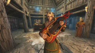 Best Skyrim mods — the companion Vilja in Skyrim, playing a lute in one of Skyrim's taverns.