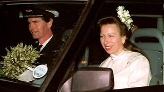Princess Anne and Sir Timothy Laurence are seen in their car after their wedding at Crathie Church
