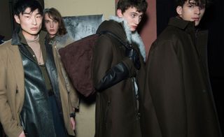 Male models wearing dark coats and accessories from Lanvin AW2015 collection
