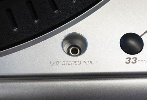 There is a 1/8-inch stereo input on the top of the turntable.