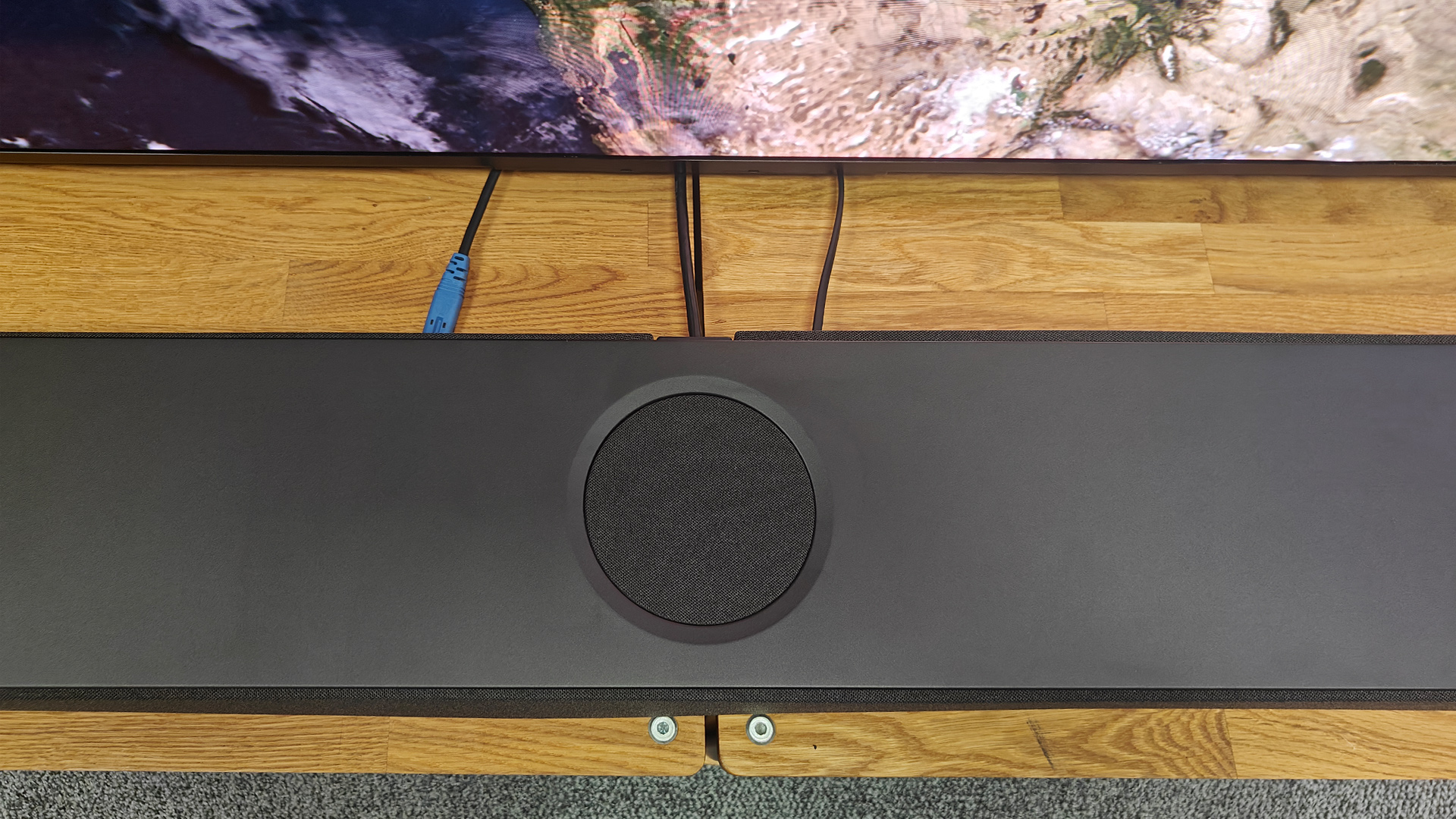 KEF XIO soundbar top-down view of central driver showing cables coming off back