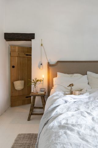 neutral bedroom with natural textures and colors, in a Victorian cottage scandi bedroom
