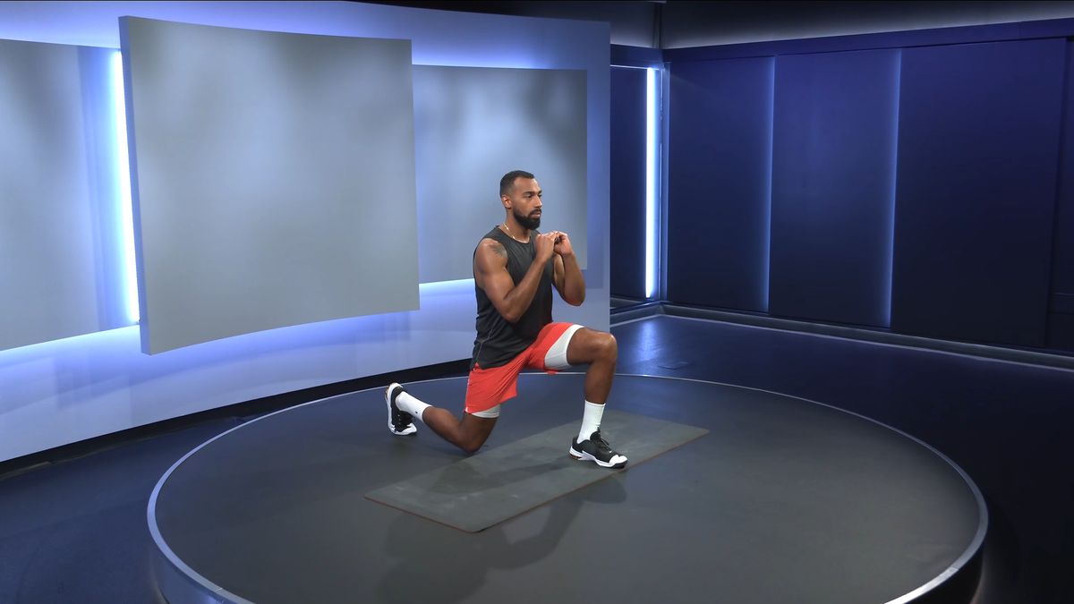 Peloton instructor Jermaine Johnson demonstrates the lunge exercise