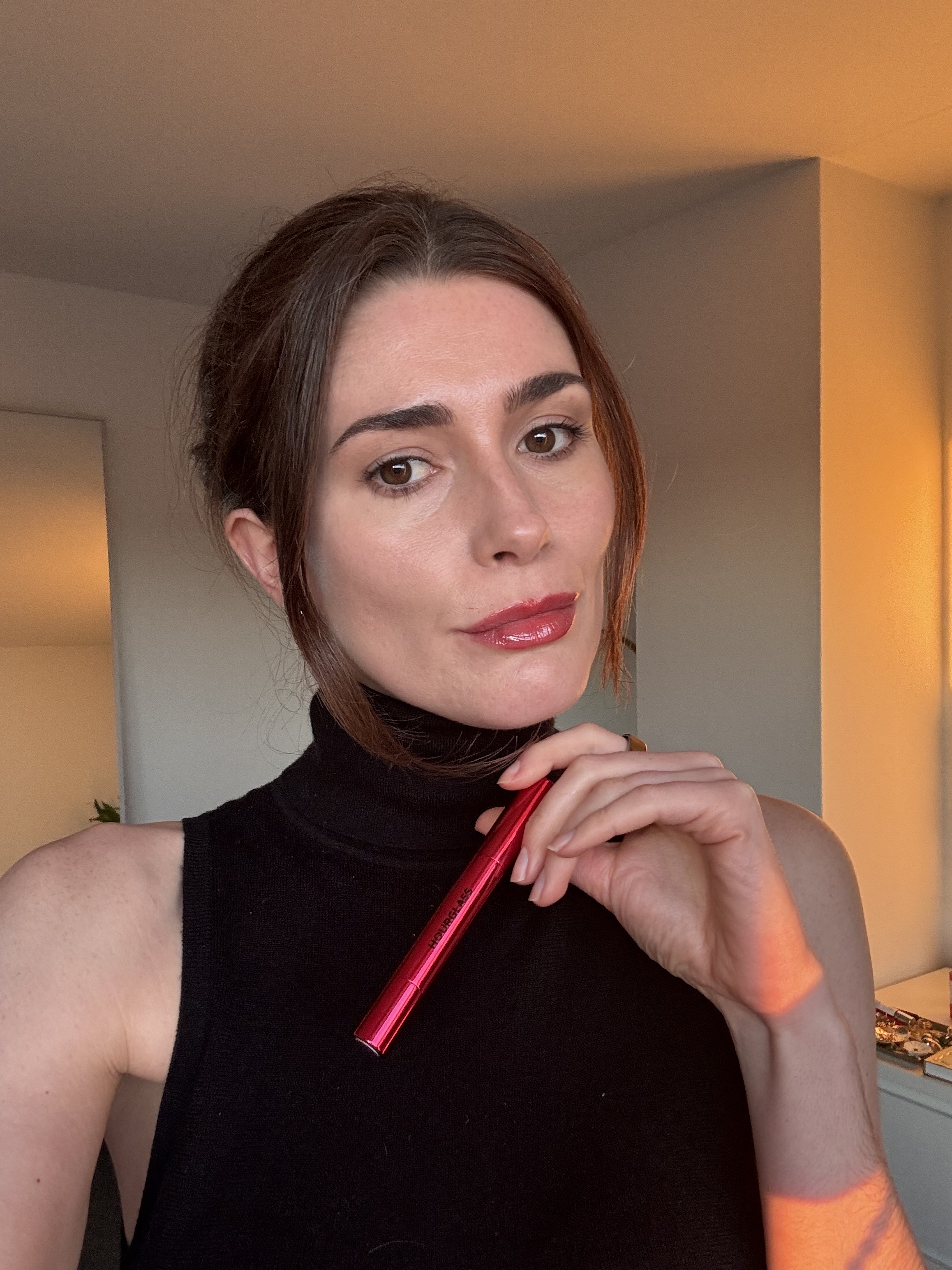 Eleanor wearing Hourglass Phantom Glossy Balm in Red 01