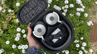 OneSonic Studio Pro headphones with white flowers in the background 