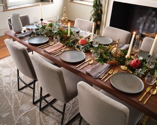 Christmas dining table with garland and fruit