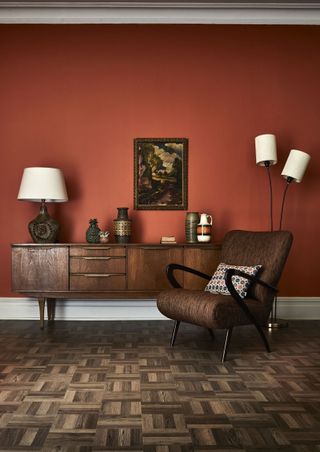 small living room with orange walls retro sideboard