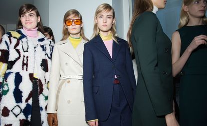 Female models wearing navy, beige and patterned clothes from the Jil Sander A/W 2015 collection