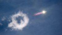 a rocket leaves a streak of fire and smoke in the sky