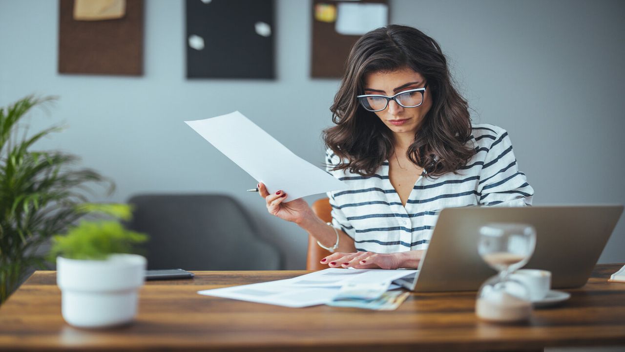 woman looking at paperwork