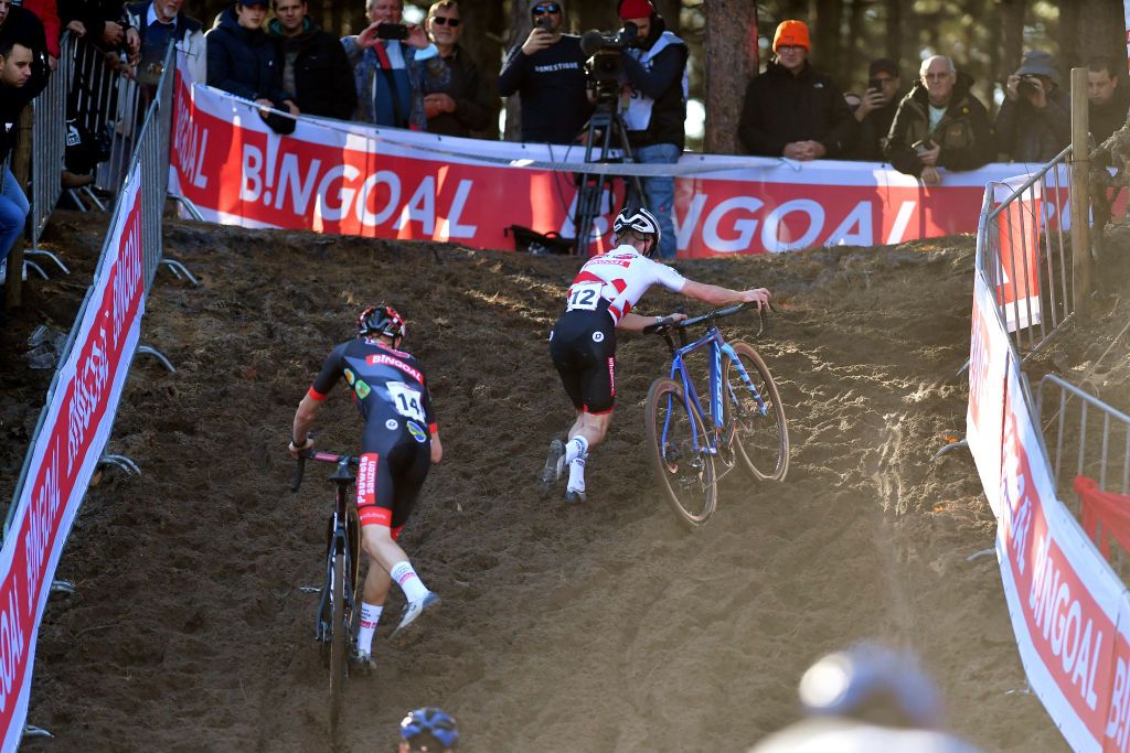 ZONHOVEN BELGIUM OCTOBER 24 LR Michael Vanthourenhout of Belgium and Team Pauwels Sauzen Bingoal and Eli Iserbyt of Belgium and Team Pauwels Sauzen Bingoal compete during the 25th Zonhoven UCI CycloCross Worldcup 2021 Mens Elite CXWorldCup UCIcyclocrossWC zonhoven on October 24 2021 in Zonhoven Belgium Photo by Luc ClaessenGetty Images