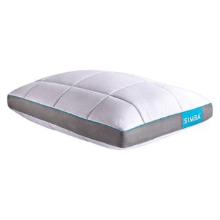 The white rectangular Simba Hybrid Firm Pillow with grey mesh side panels and blue branded label