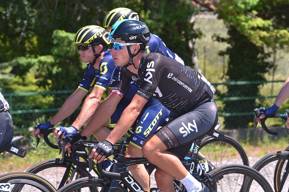 Peter Kennaugh rides alongside the Orica-Scott team