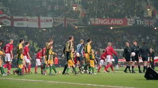 England and Australia walk out for a friendly at Upton Park in February 2003.