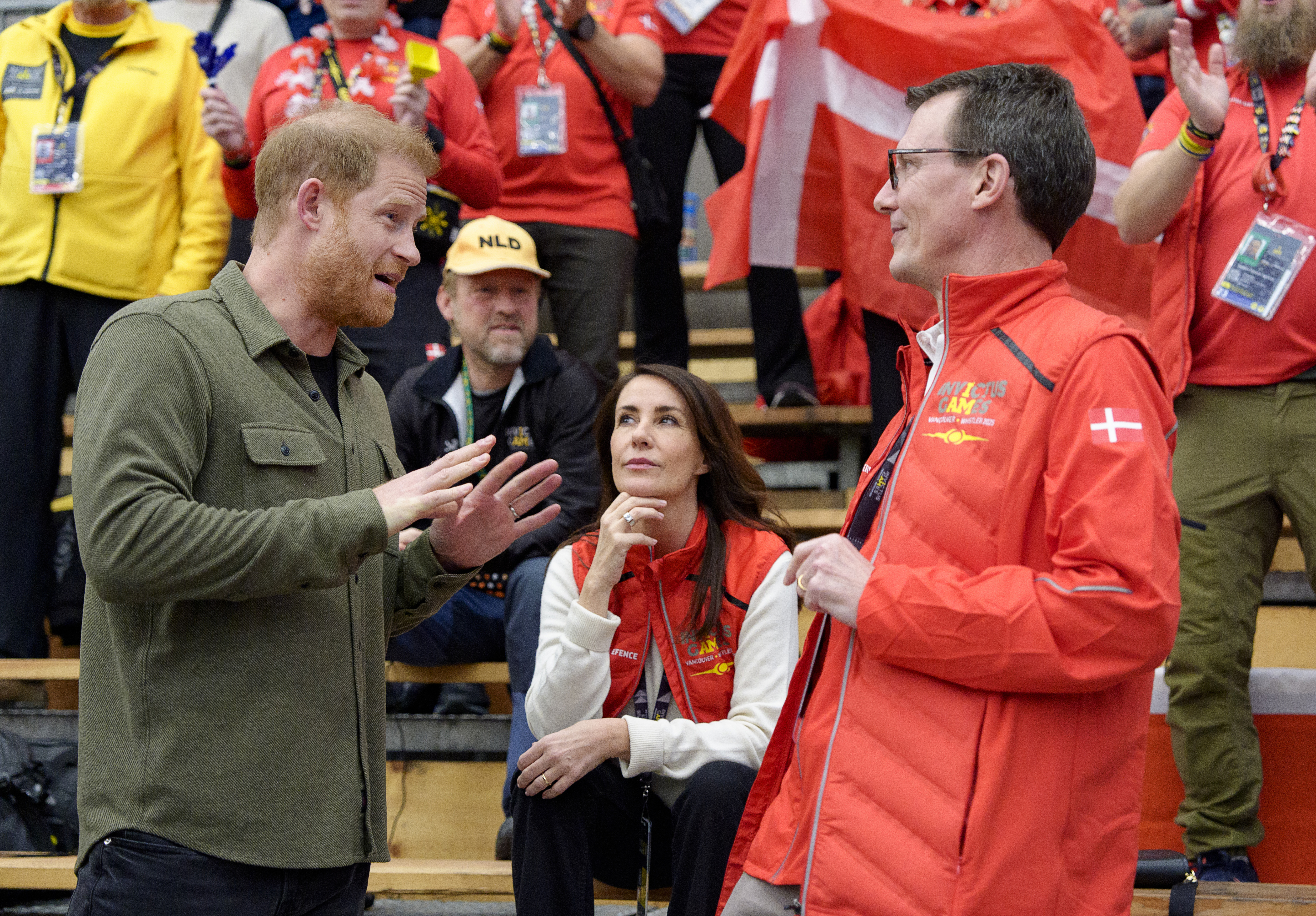 Prince Harry talking to Princess Marie and Prince Joachim of Denmark at the Invictus Games