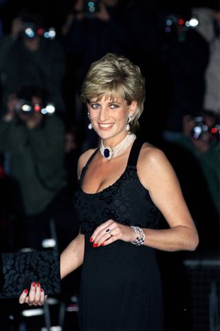 Princess Diana arrives at a Gala in aid of cancer research at Bridgewater House, London, wearing a Jacques Azagury gown