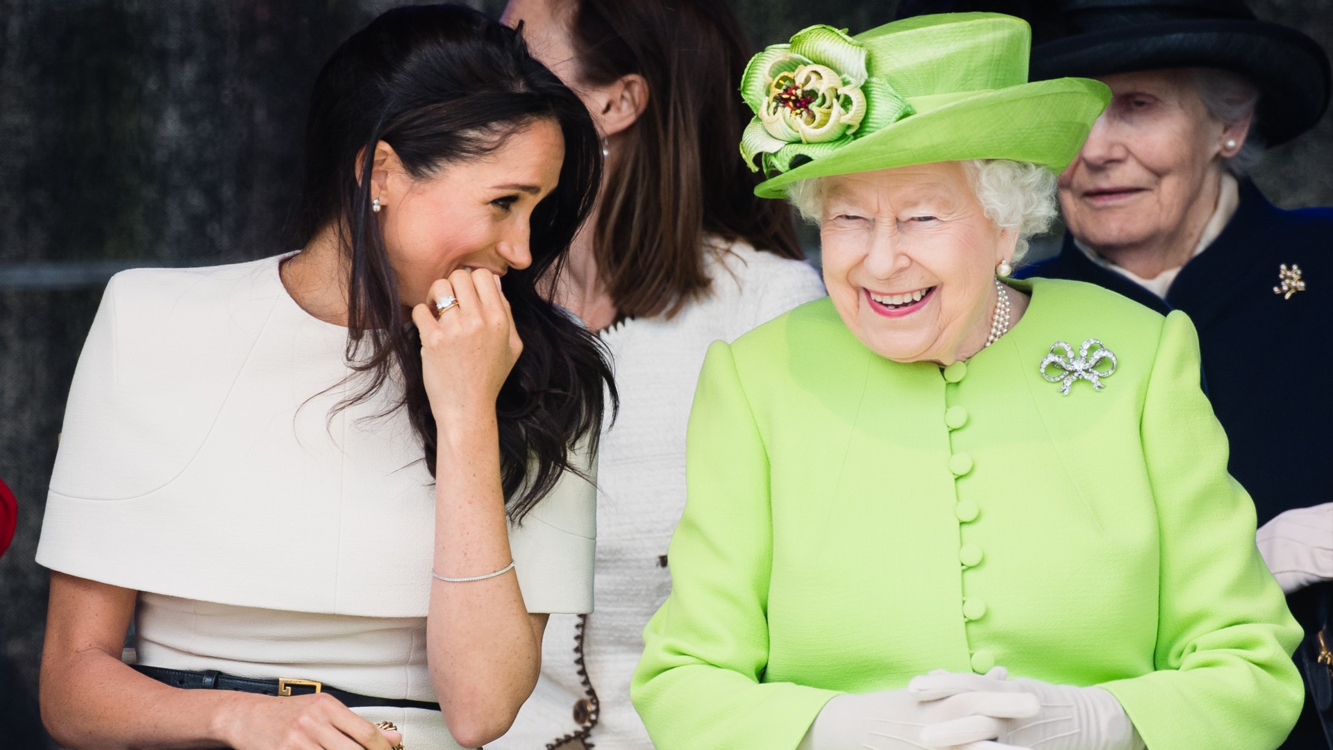 The Queen Worried Prince Harry Was “Too Much in Love” with Meghan Markle, New Book Claims