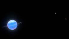 Photo of Uranus surrounded by bright spots, which are its moons