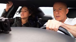 Michelle Rodriguez and Vin Diesel drive in a car in F9