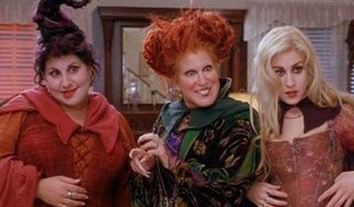 Hocus Pocus the Sanderson sisters looking excited and apprehensive in a kitchen