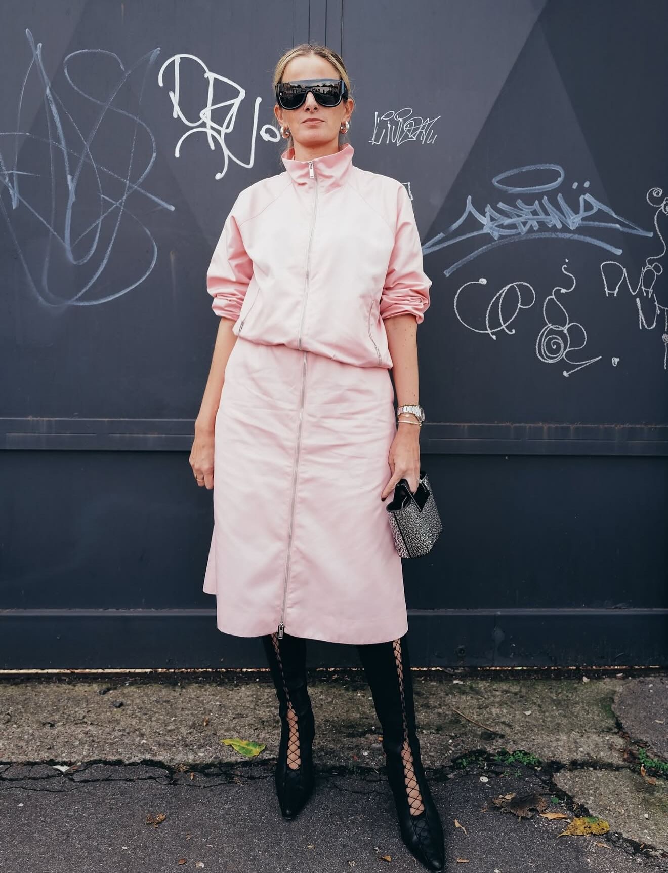 Influencer wearing knee high boots for winter.