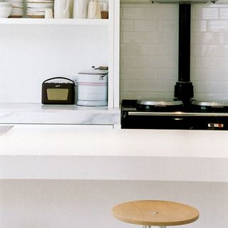 kitchen with open crockery shelf white wall