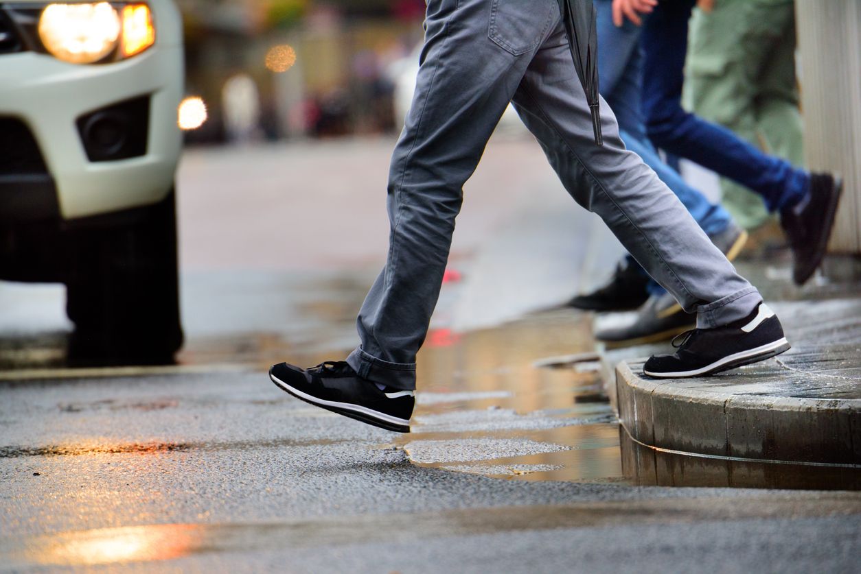 Pedestrian prepared to cross street.