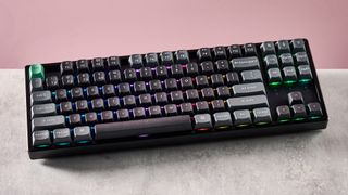Top-down view of Keychron K8 Ultra 8K on desk with pink wall in background