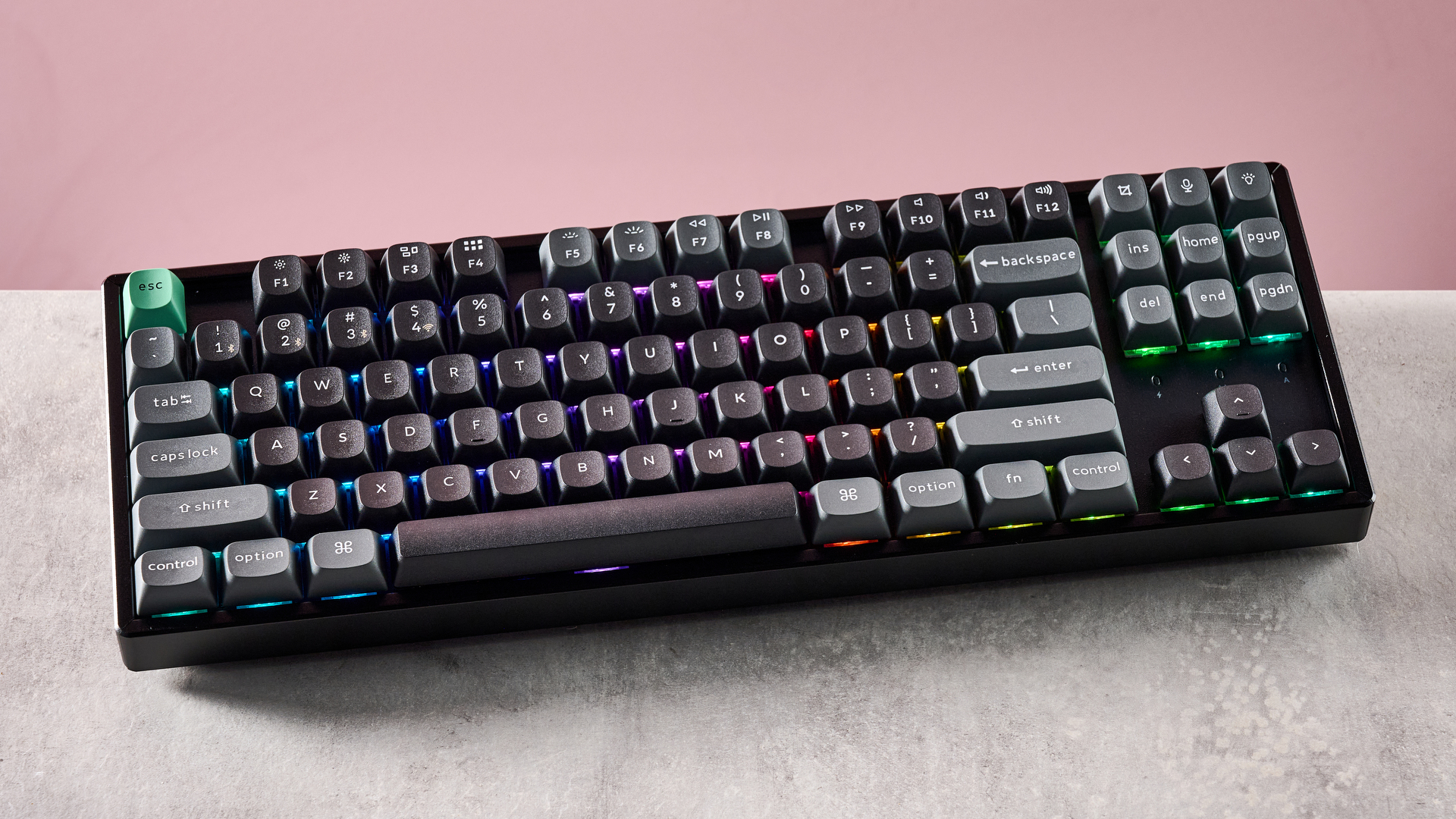 Top-down view of Keychron K8 Ultra 8K on desk with pink wall in background