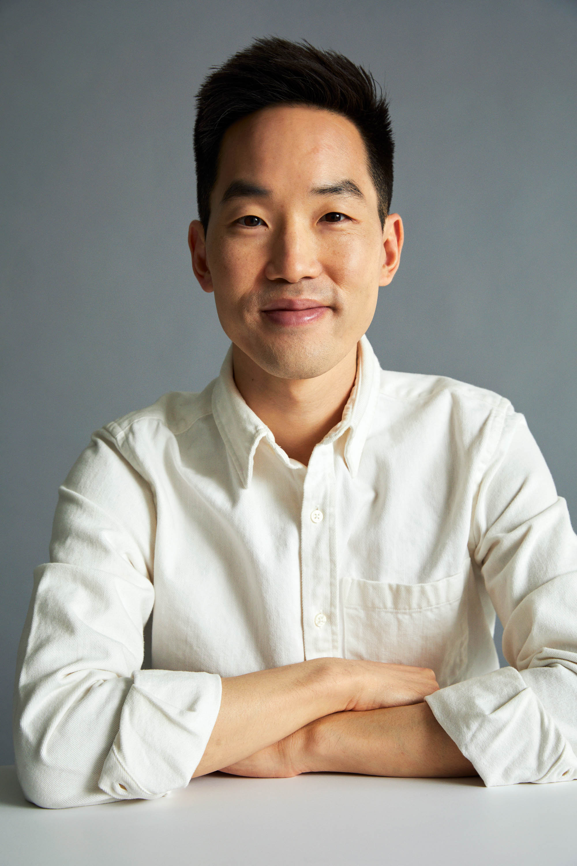 Dr. David Kim in a white shirt