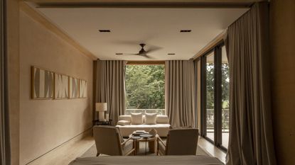 A living room painted a light brown tone