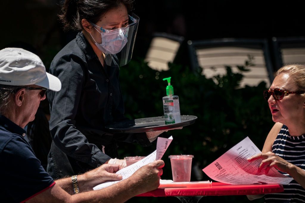 People eat outside during coronavirus pandemic.