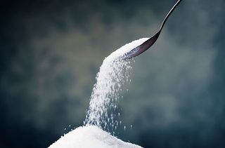 sugar falling from spoon