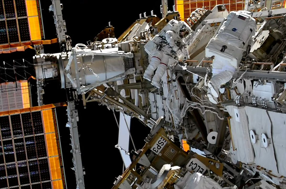 With a 'wiggle and nudge,' spacewalking astronauts install stubborn array mount outside space station