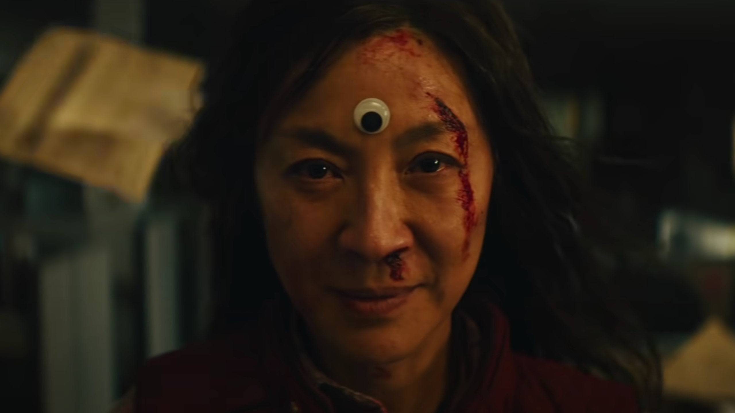 Michelle Yeoh's Evelyn looks at the camera in Everything Everywhere All At Once