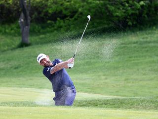 Andy Sullivan hitting a bunker shot from a fairway bunker