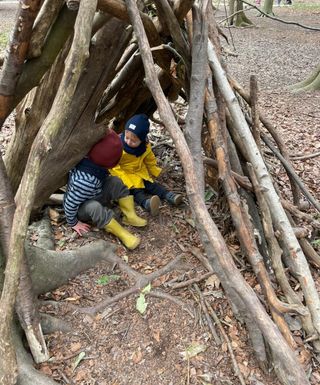 Gruffalo Trail with forts and dens with kids sat in them
