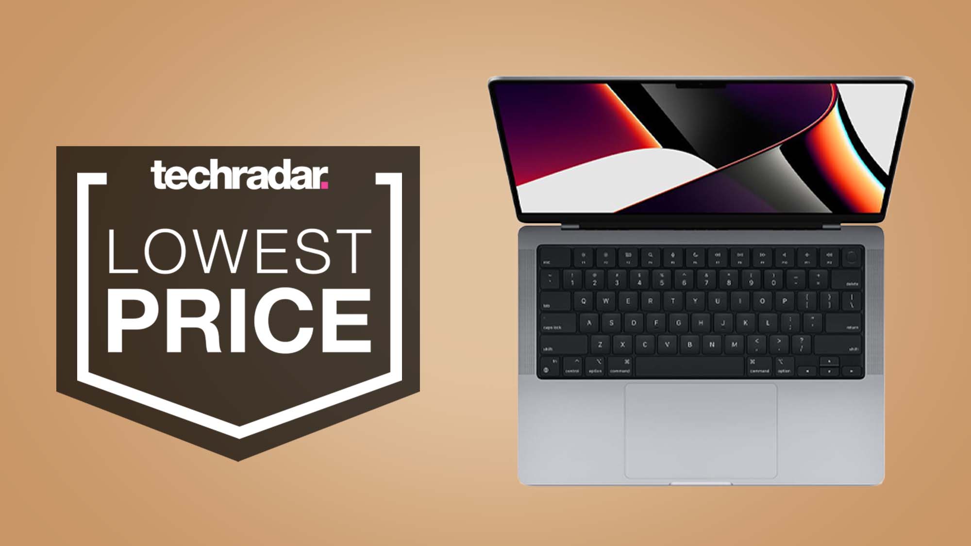 A MacBook Pro 14-inch seen from above against a tan background with a TechRadar Lowest Price badge