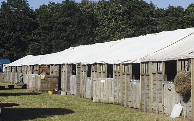 event stables , wooden stables with canvas roofs , temporary stabling ,