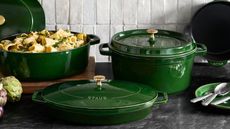 The best Dutch oven, Staub Enameled Cast Iron in Basil Green on a marble kitchen counter 